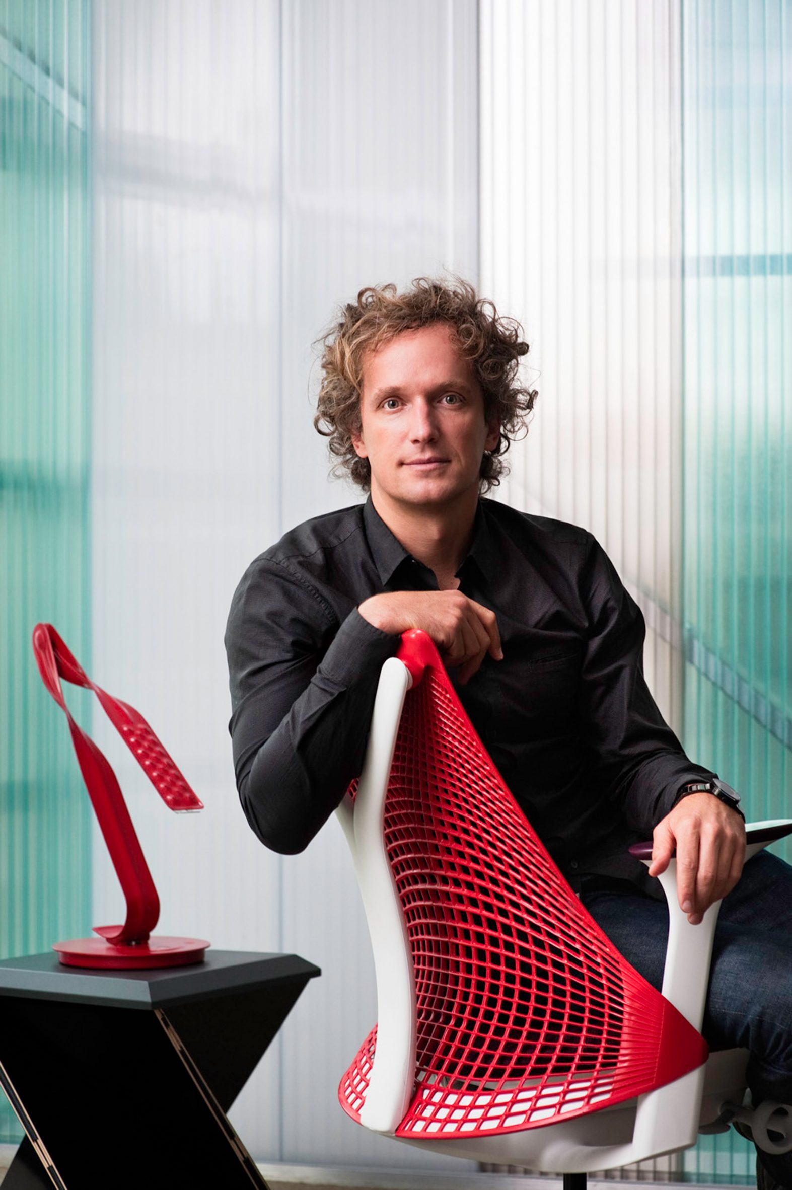 Designer Yves Béhar sitting on a chair