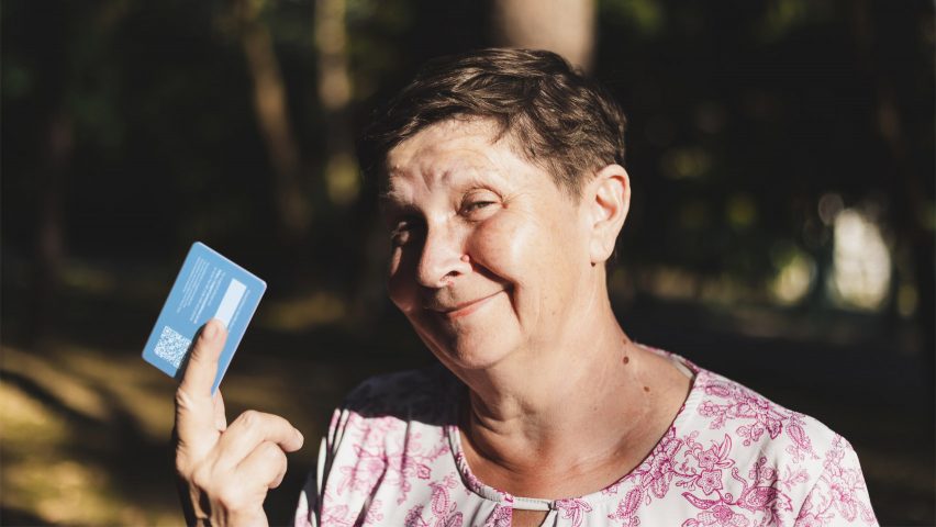 Woman holding ProxyAddress card