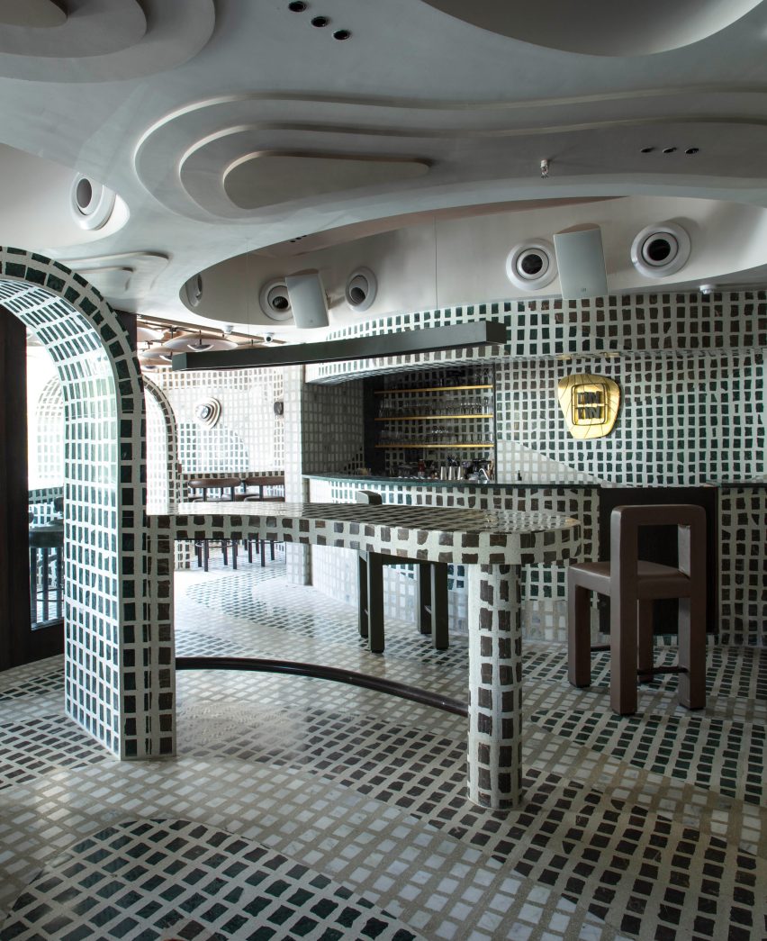 Green mosaic interior of the Tin Tin restaurant