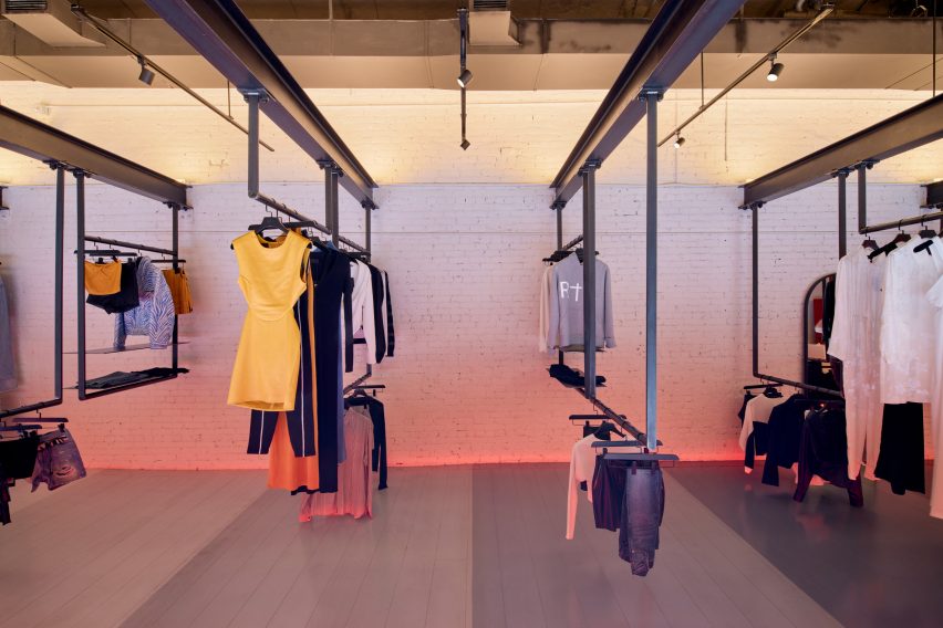 Clothes hung from suspended steel beams