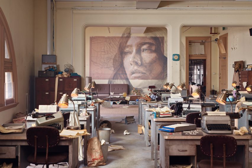 Industrial interior space with work stations at the Time exhibition by Rone