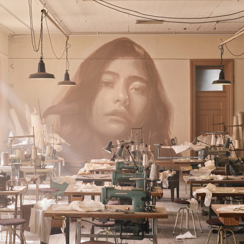 Industrial interior with rows of sewing machines at the Time exhibition by Rone