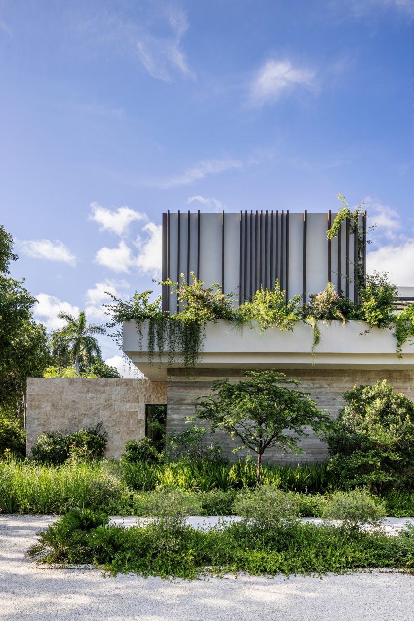 Rectilinear mansion in Miami covered in lush greenery