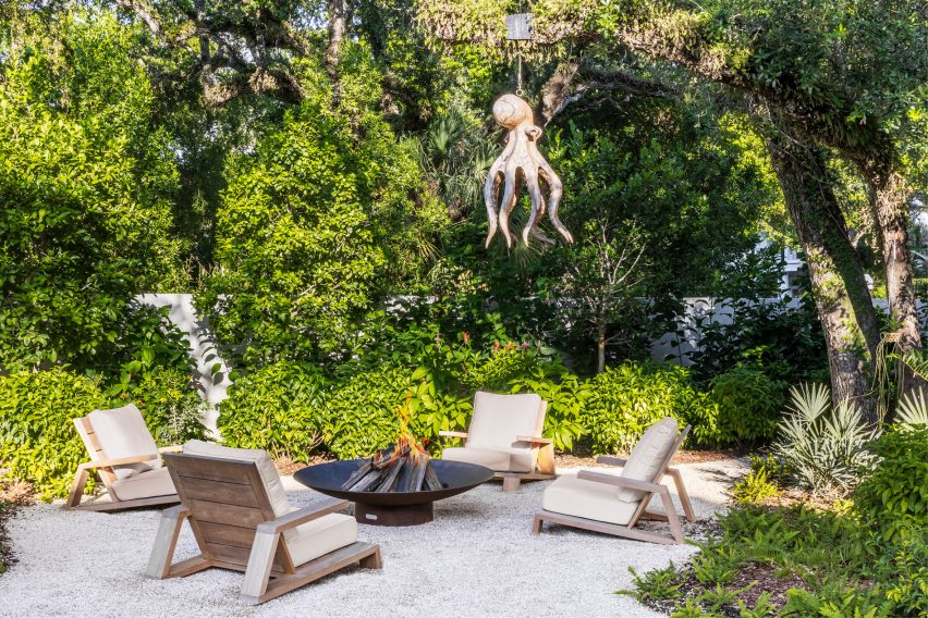 Octopus suspended from trees around firepit outside Miami residence