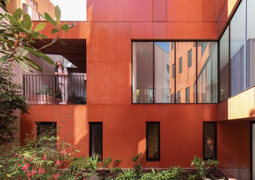 Red-dyed concrete facade on rectilinear building