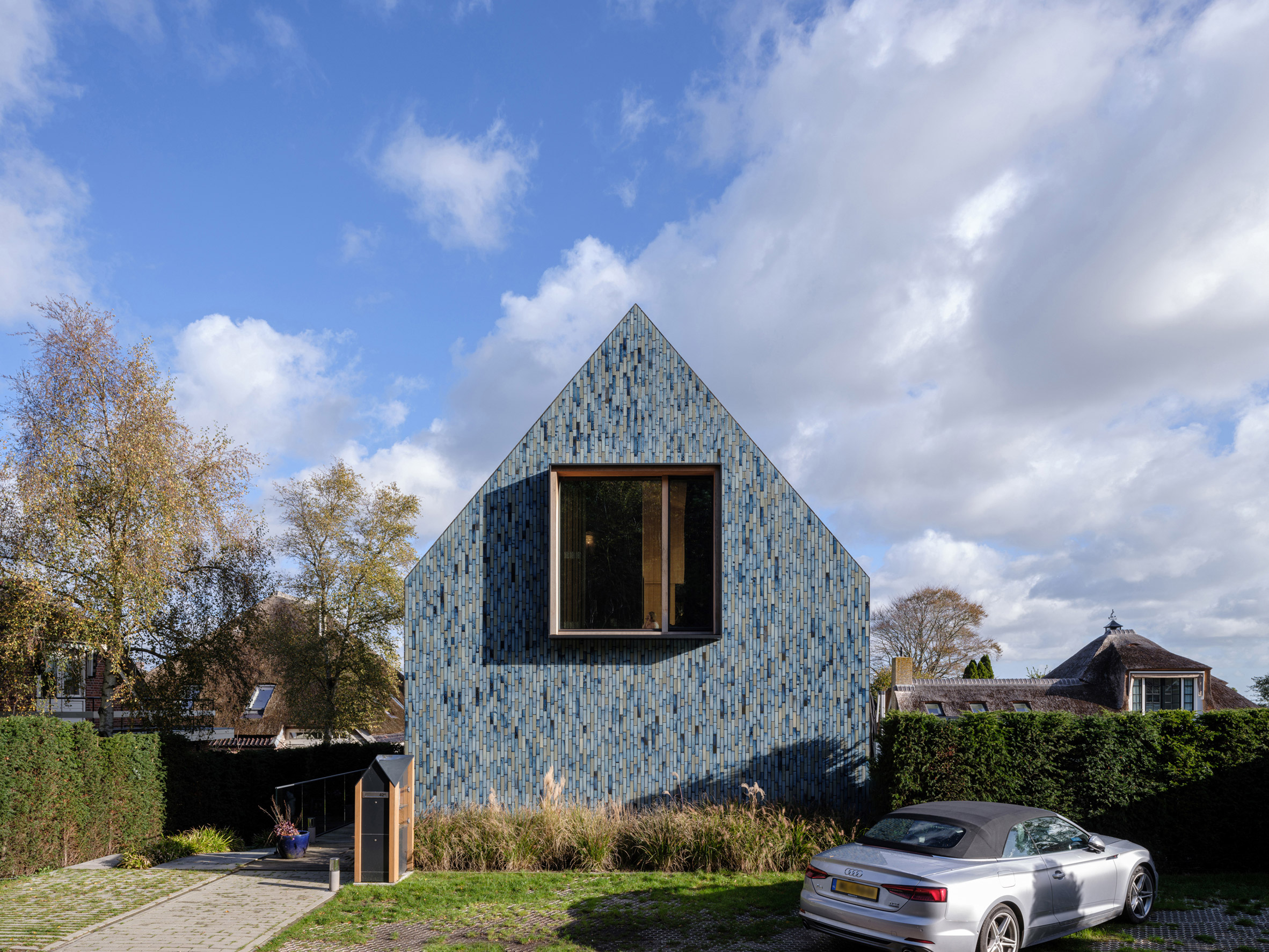 Blue-tiled elevation of Villa BW in the Netherlands