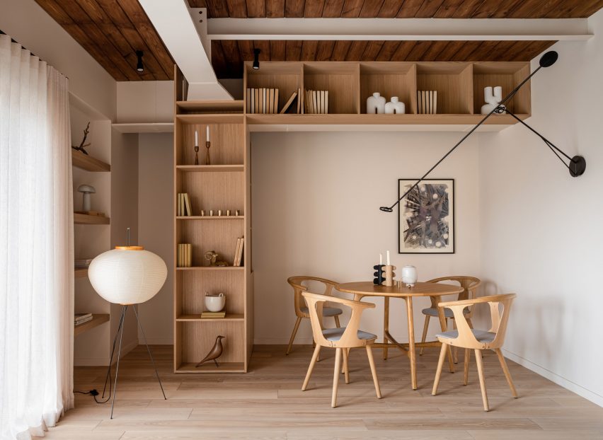 Shelving and dining space in interior of Kyiv apartment by Yana Molodykh