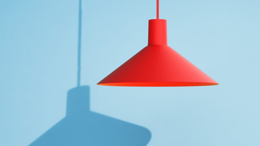 Red pendant light on blue backdrop
