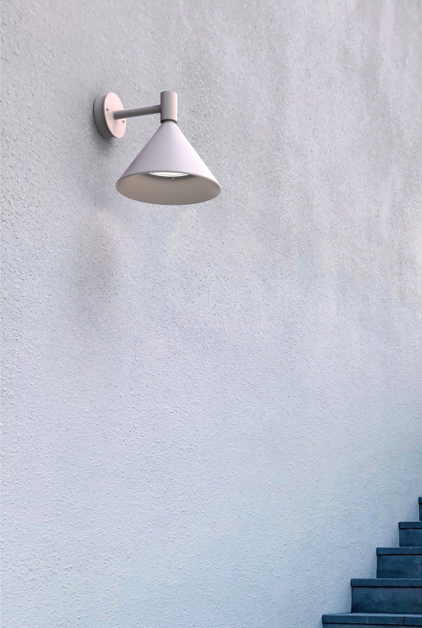 White sconce lamp on exterior wall above outdoor staircase