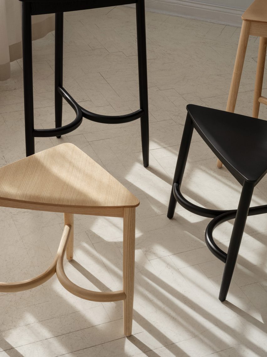 Photograph of four wooden Tripot stools designed by Fogia and Inga Sempé