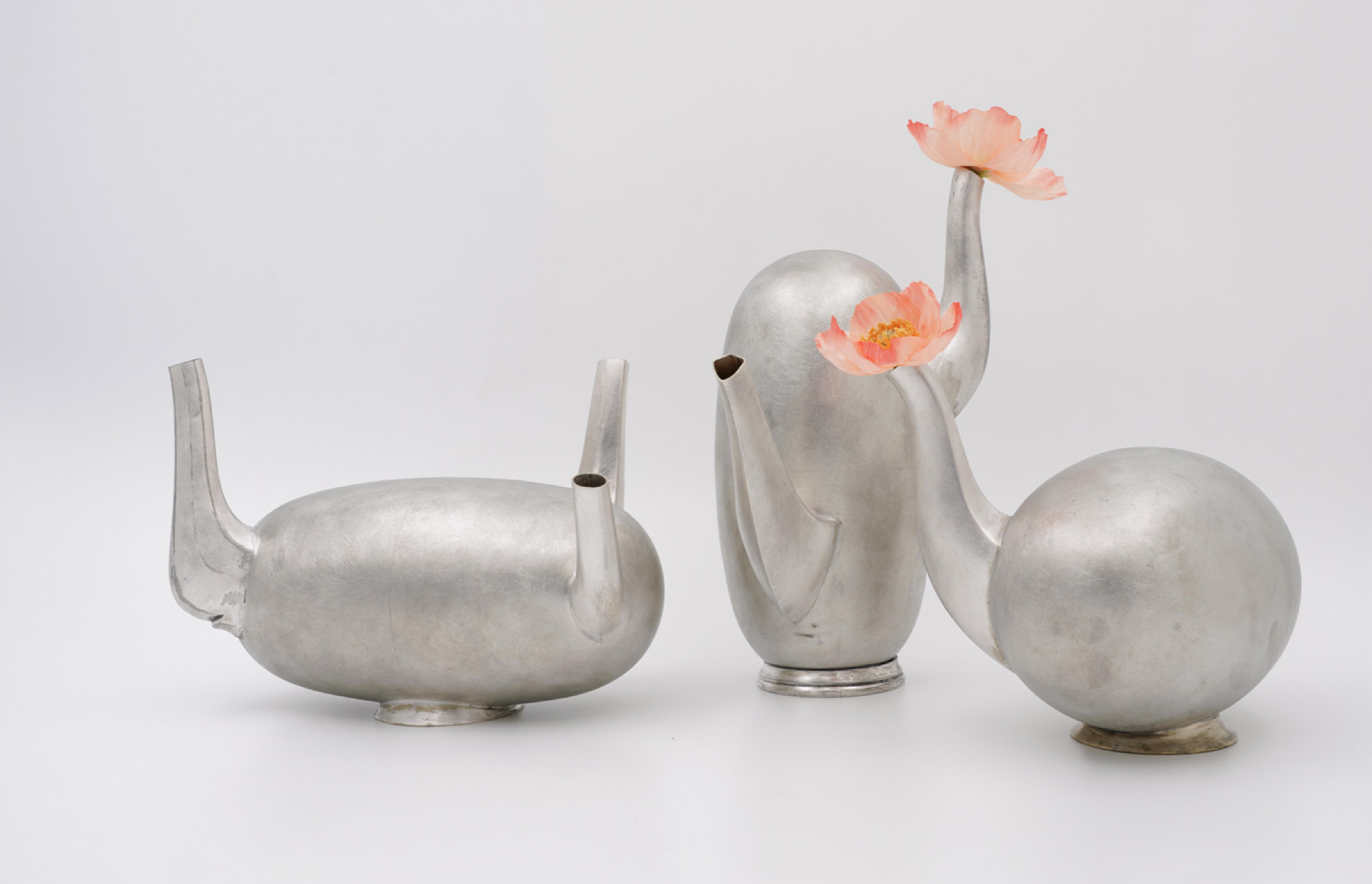 Three silver vases