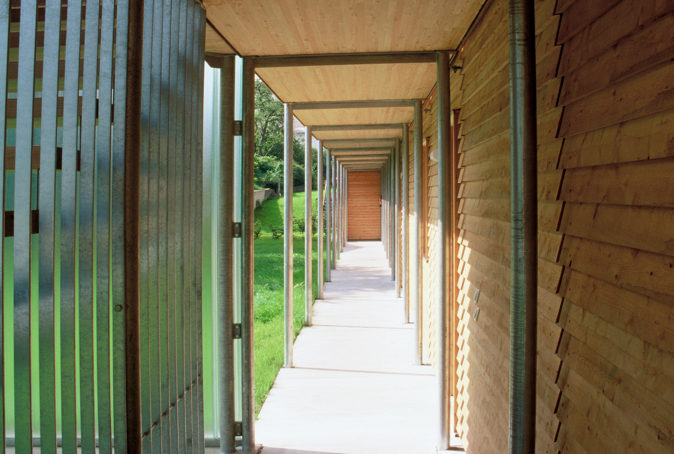Hallway in Ölzbündt building in Austria by HK Architekten