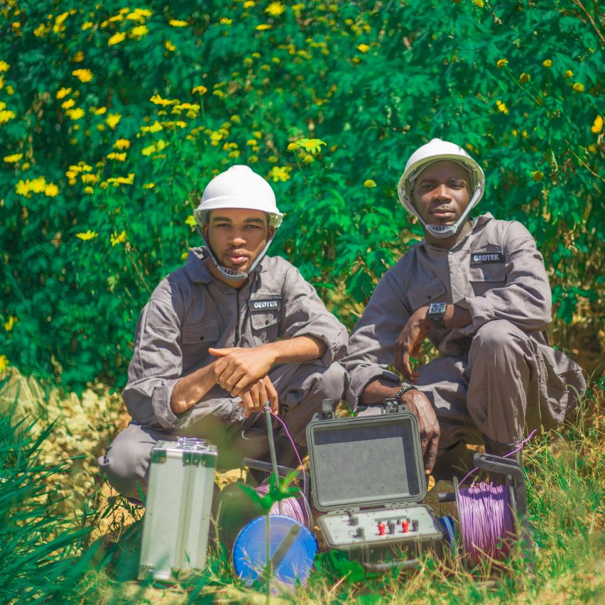Two designers next to a device designed to monitor pollution in water wells