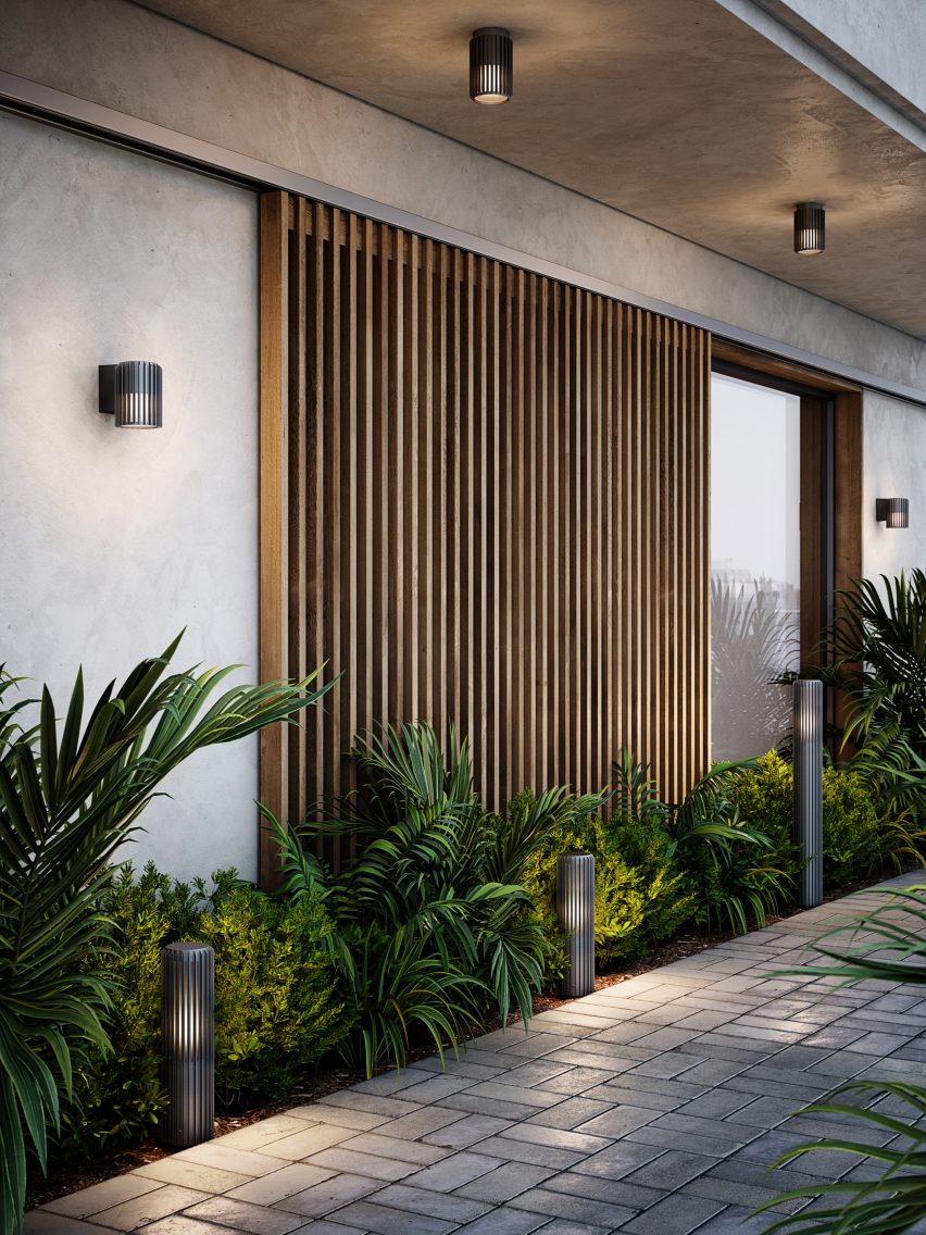 Aludra garden lighting and wall light in an outdoor area with square tiles and planted edge