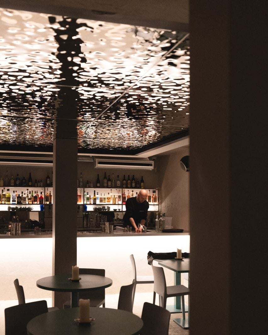 Bar with hammered-metal ceiling in Bao Express restaurant in Paris