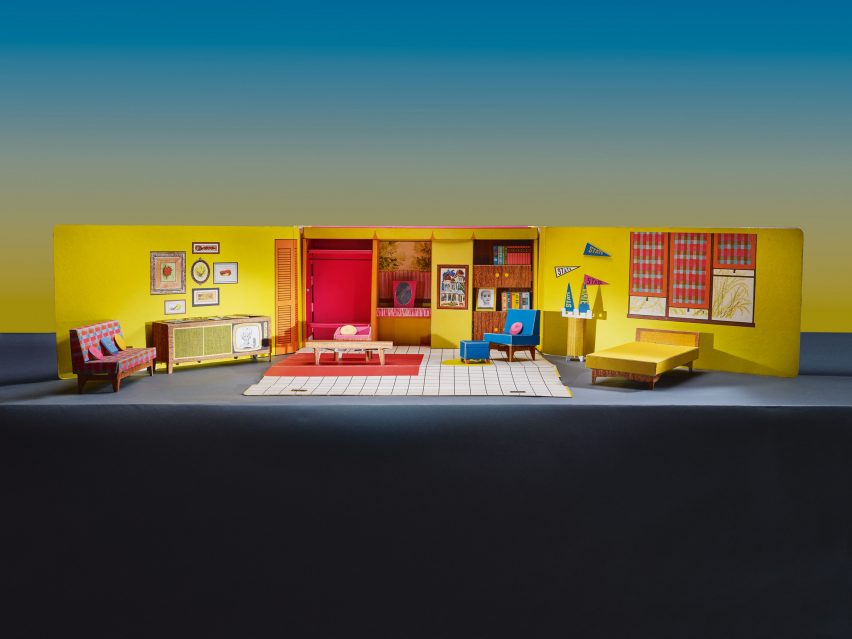 A dollhouse from 1962 on a blue backdrop