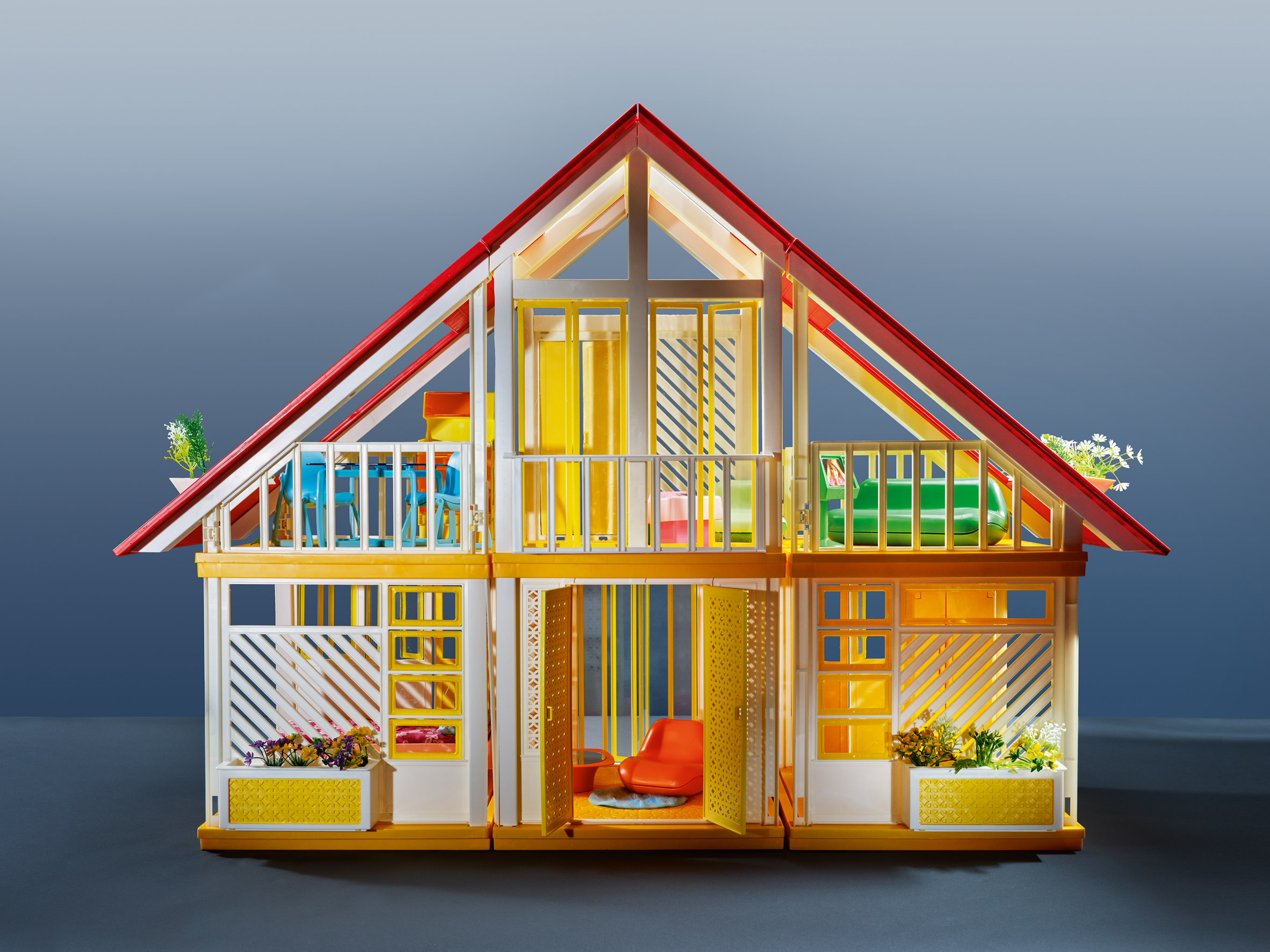 A gabled plastic doll house