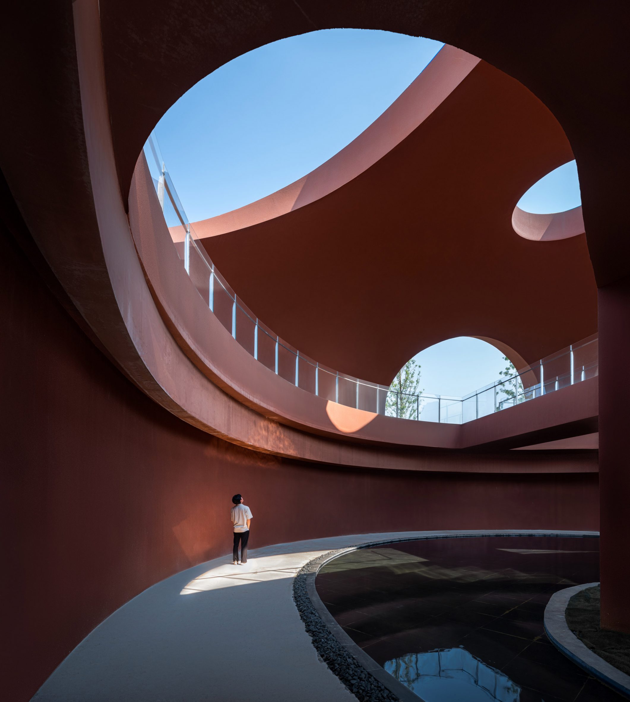 Courtyard surrounding by red-concrete walls