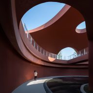 Undulating concrete landscape conceals Chinese cultural centre by Change Architects