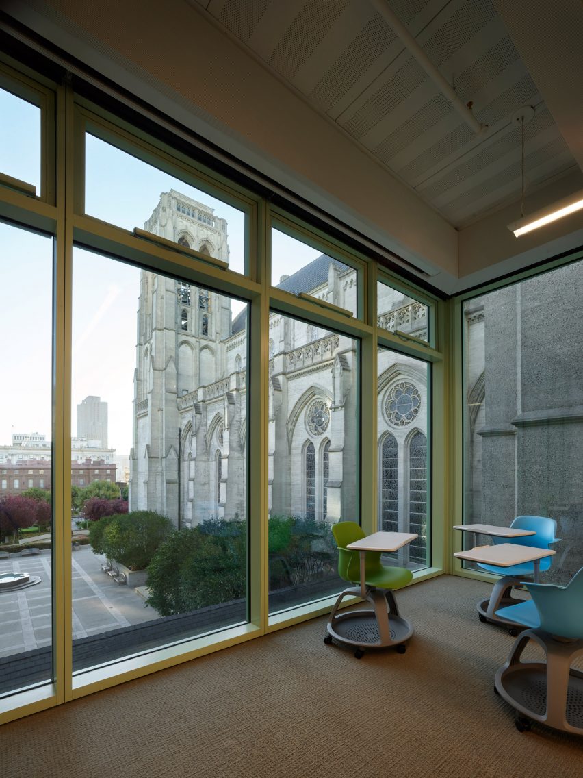 Interior working space with glazed walls overlooking a catherdral