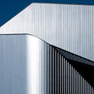 Close up of the sweeping steel panels at the 010 Building by Clouds AO