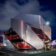 Exterior of a theatre building with sweeping steel panels by Clouds AO