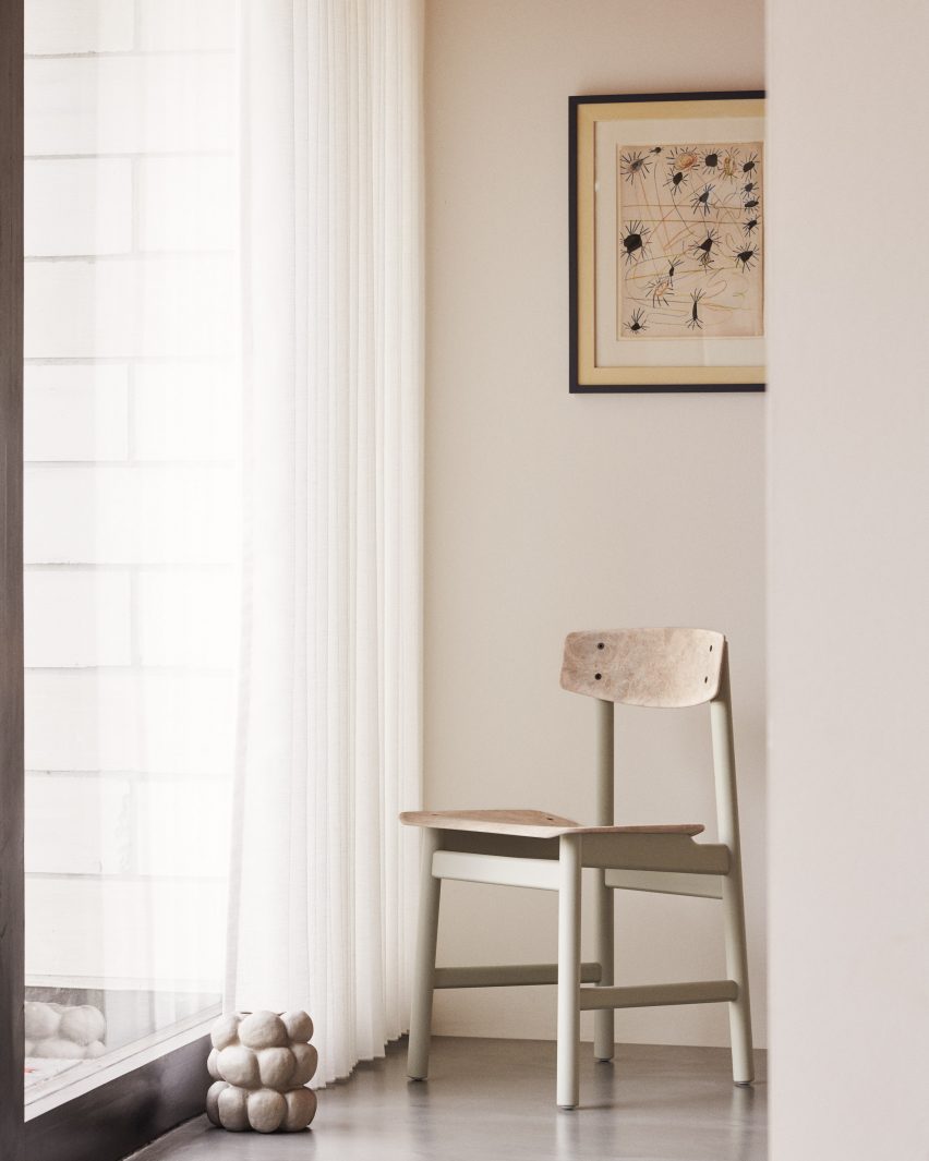 Neutral coloured chair in front of window