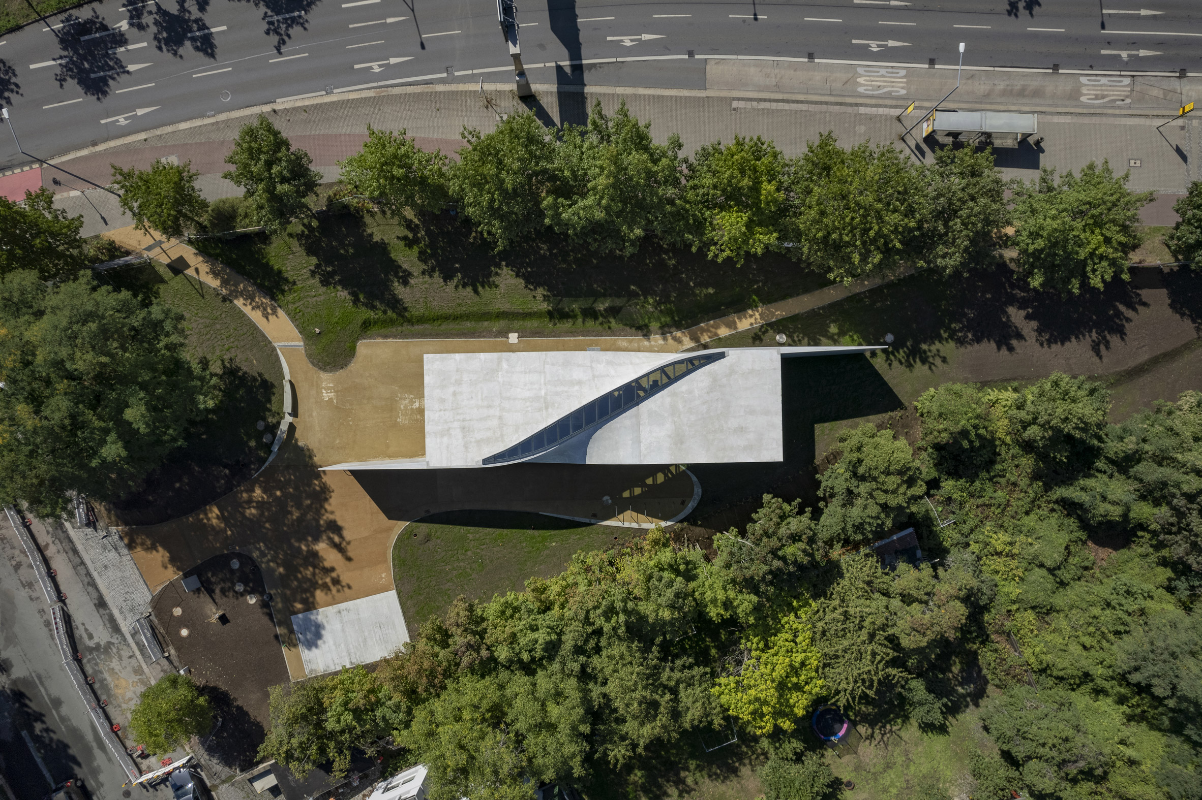 Aerial view of the Cube building at TU Dresden surrounded by trees