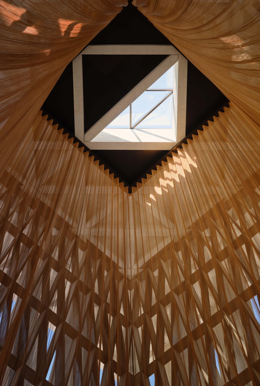 Bronze mesh tent within synagogue by David Adjaye in Abu Dhabi