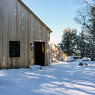 Gable end of a timber-clad home in the snow