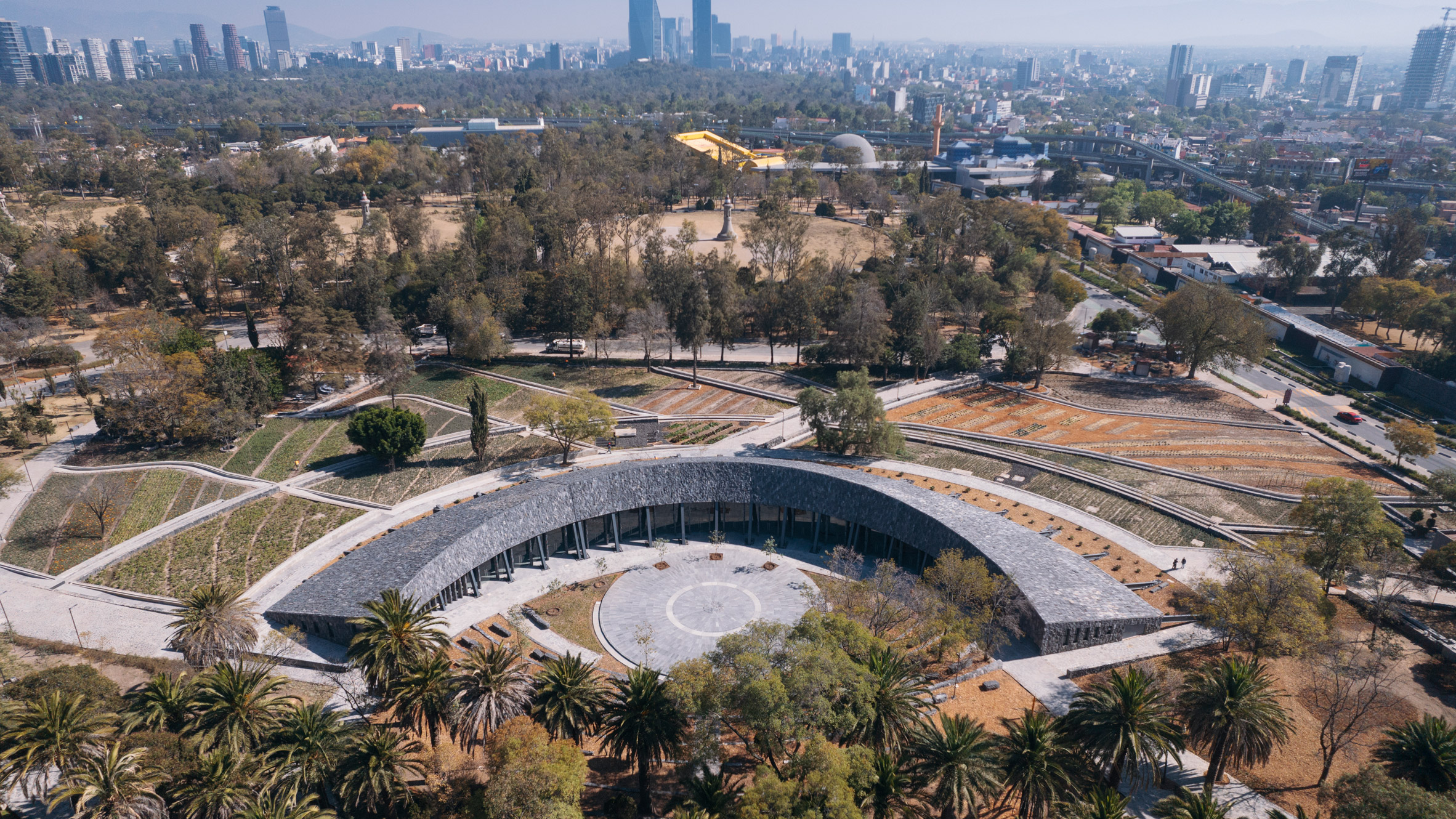 Erre Q Erre replaces parking lot with stone pavilion in Mexico City