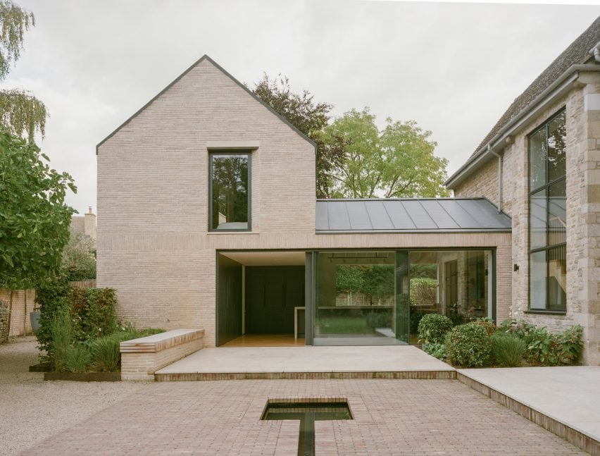 Gabled extension clad in bricks by Studio McW