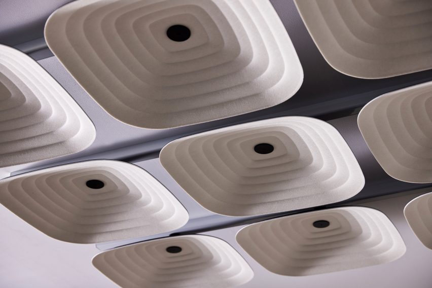 Close-up photo of square Fuji acoustic ceiling tiles showing the inside of their 3D shape