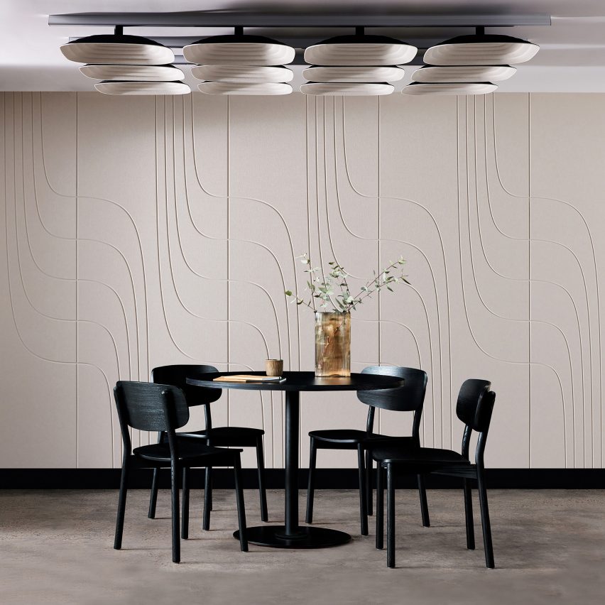 Photo of white square Fuji acoustic ceiling tiles suspended above a square dining table