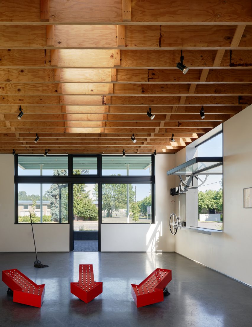 Exposed wooden rafters and operable window