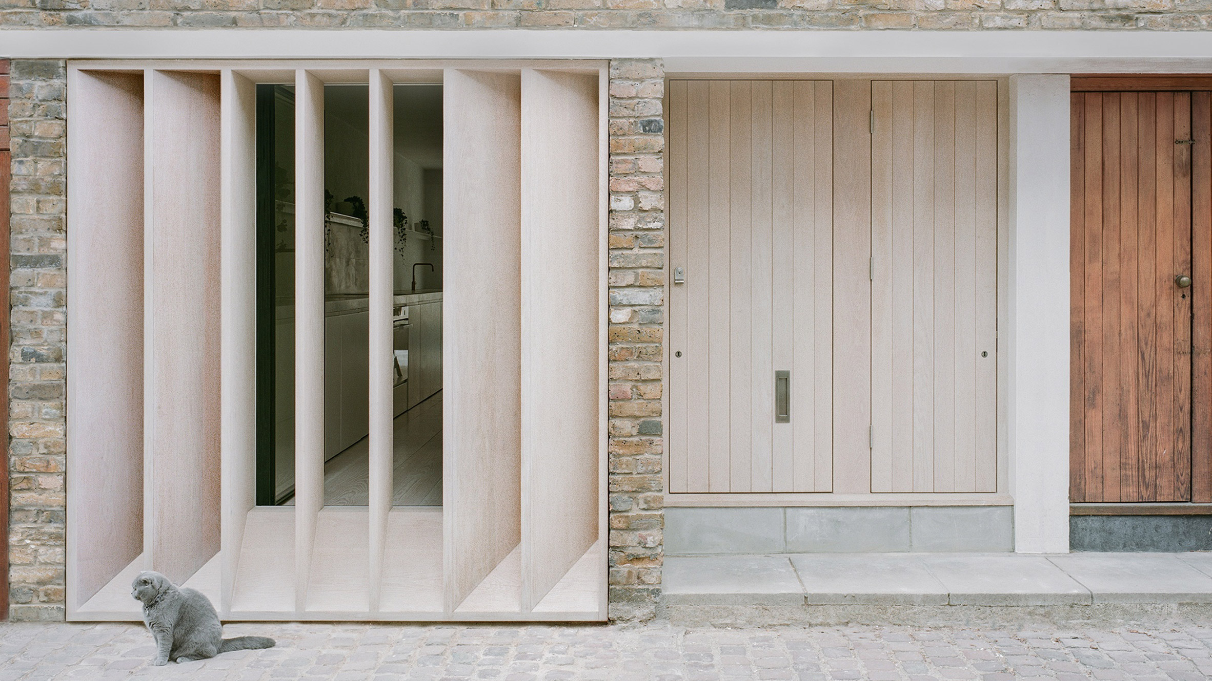 Trewhela Williams adds louvred oak facade to London mews house