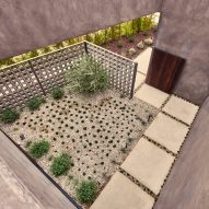 Roof terrace with planted garden and square paving tiles