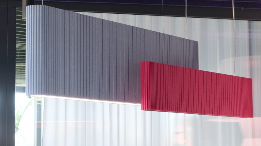 One pink and one blue pendant lamp with acoustic panelling