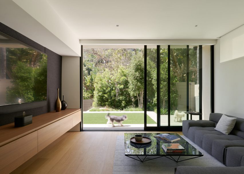 Large glass sliding doors leading to garden at Canyon Terrace House