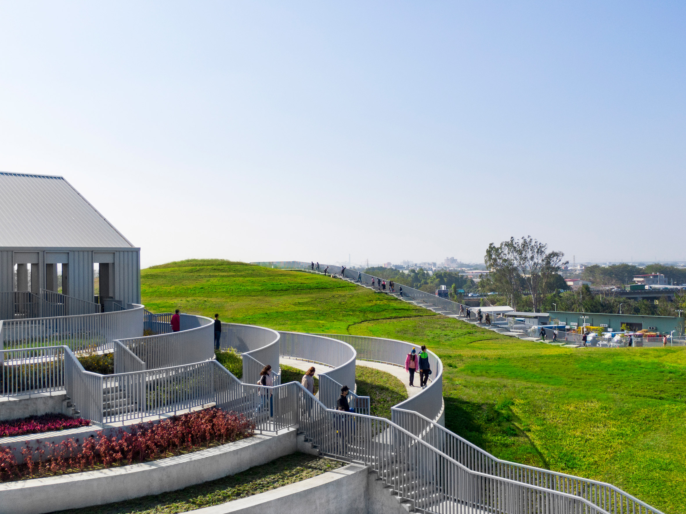 Stepped planted terraces surrounded by a grassy mound