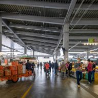 Open-air food market with tall ceilings