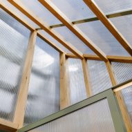 Interior of a polycarbonate shed with a mono-pitched roof and timber structure