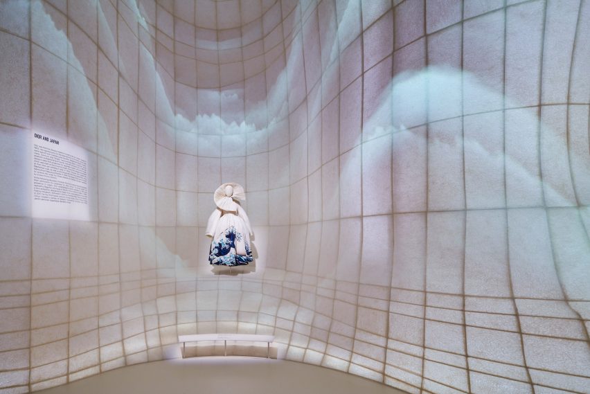 Mannequin set against illuminated washi paper in OMA-designed Dior exhibition