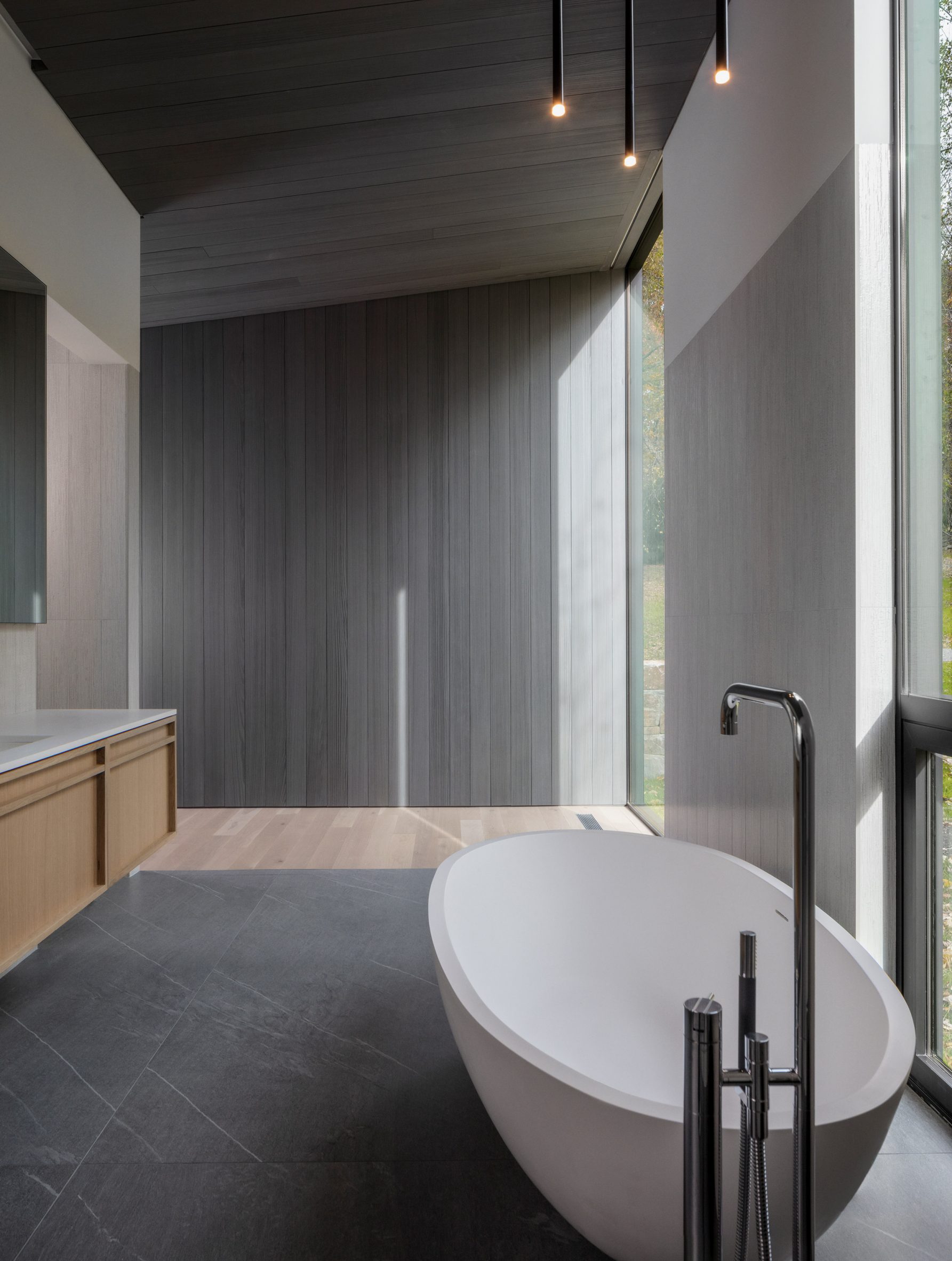Glazed wall tiles in bathroom of Roxbury House by Desai Chai Architects