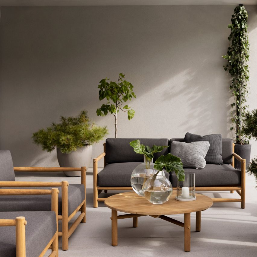 Grey upholstered sofas in a living space with plants