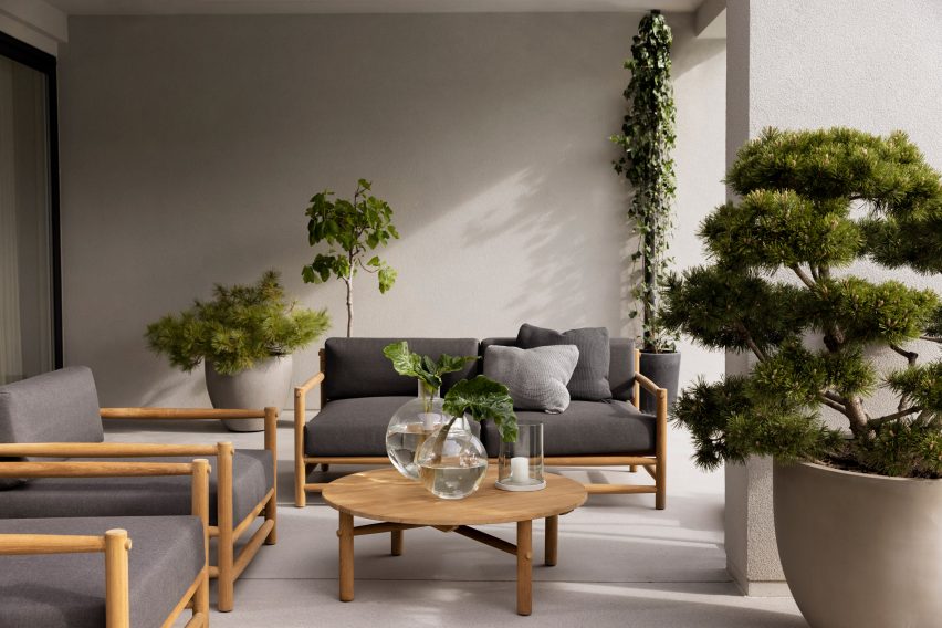 Grey upholstered sofas in a living space with plants