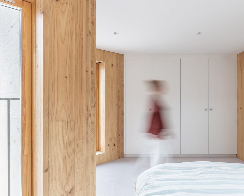 Bedroom with exposed timber walls