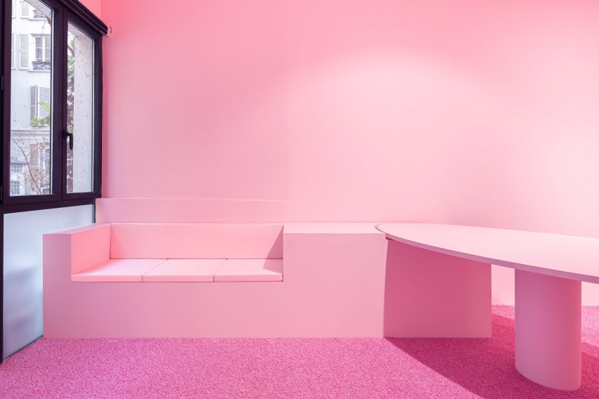 "Pink den" with synthetic pink grass within art gallery