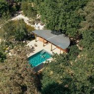 Surman Weston nestles geometric pool house in gardens of Surrey home