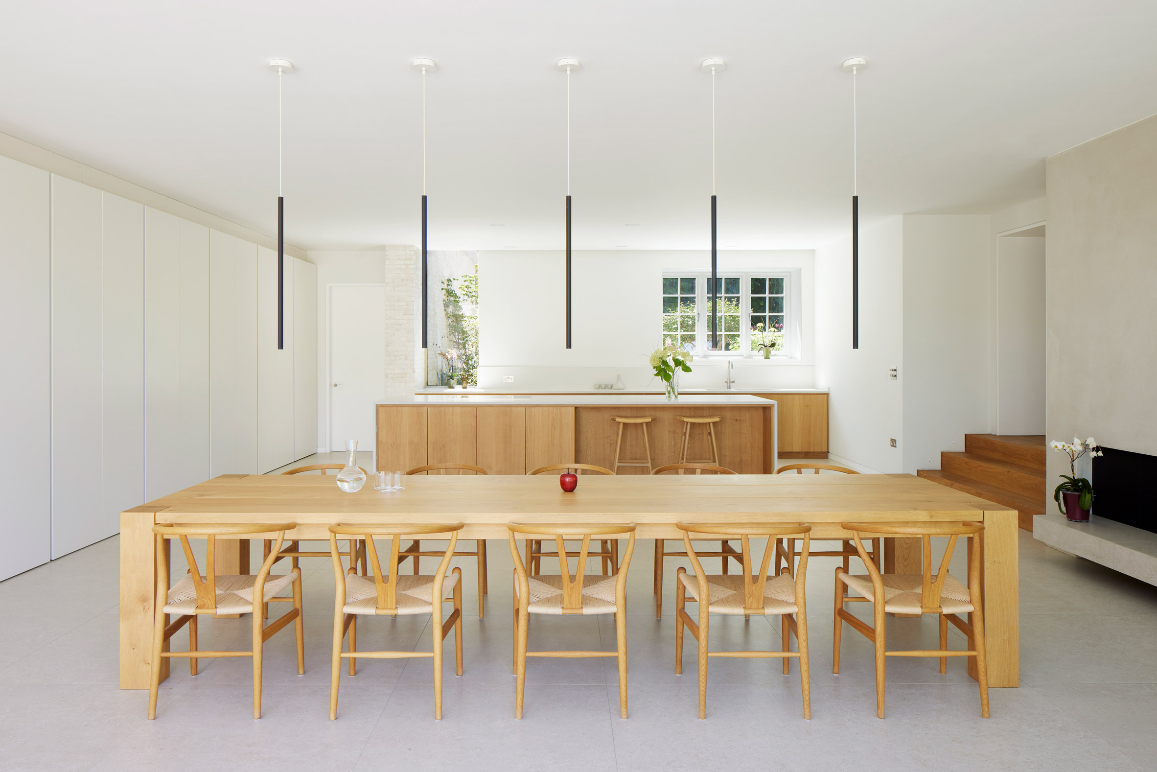 Kitchen and dining table in The Pines house extension by Ström Architects
